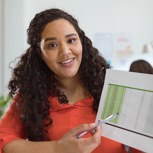 happy business owner with monthly bookkeeping report