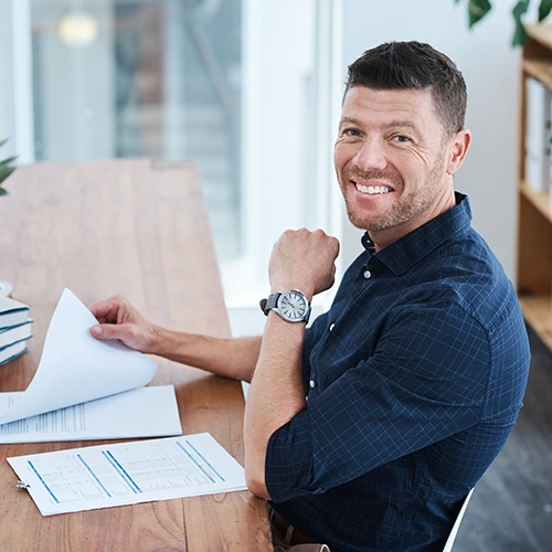 business owner with tax advisory and planning report